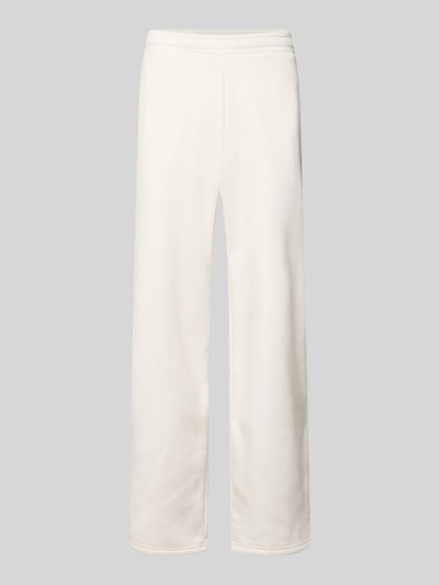Produktfoto, Regular Fit Sweatpants mit Gesäßtasche von REVIEW aus Baumwoll-Mix in Creme, lockerer Schnitt, elastischer Bund, glatte Textur.