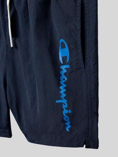 Productfoto, Badehose met steekzakken en logoprint van CHAMPION voor kinderen, loose fit, elastische band met trekkoord, donkerblauw, structuur glad