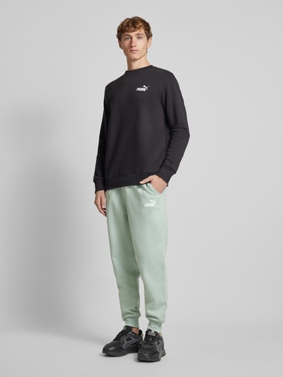 PUMA PERFORMANCE Relaxed Fit Sweatpants mit Label-Print Lind 1