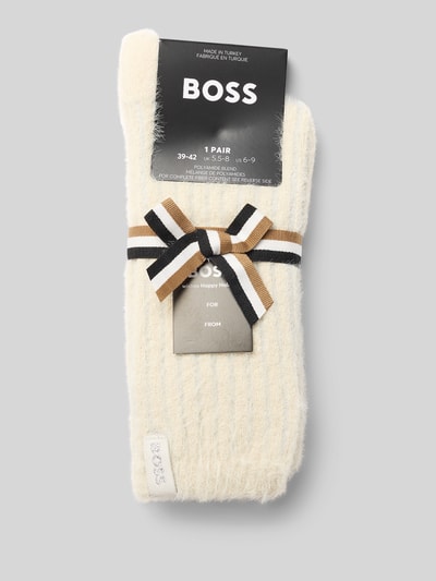 Produktfoto, Socken mit Label-Detail von BOSS in Cremeweiß mit feiner Rippstruktur, braun-schwarzer Schleife und dezenter Markenprägung, Damen Socken von BOSS