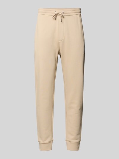 Produktfoto, Regular Fit Sweatpants aus reiner Baumwolle von ARMANI EXCHANGE in Beige mit elastischen Abschlüssen, Kordelzug, Seitentaschen, Gesäßtaschen, Label-Print, Innenbeinlänge 44 cm bei Größe M