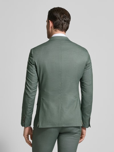 Männermodel trägt Slim Fit 2-Knopf-Sakko mit Pattentaschen von ATELIER TORINO in Grün, Material-Mix mit Viskose, Ganzkörperansicht Rückansicht.