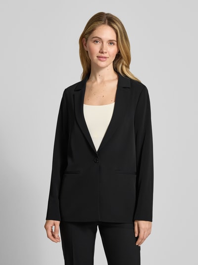 Kobiece modelka nosi Relaxed Fit Blazer mit Reverskragen od comma, elastyczna mieszanka materiałów, zapięcie na guzik, kieszenie z wypustkami, czarny, krój relaxed fit, długość tyłu w rozmiarze 36: 70 cm, szerokość w rozmiarze 36: 49 cm, długość rękawów w rozmiarze 36: 63 cm, całkowity widok z przodu