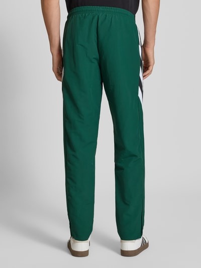 adidas Originals Spodnie dresowe z elastycznym ściągaczem Ciemnozielony 5