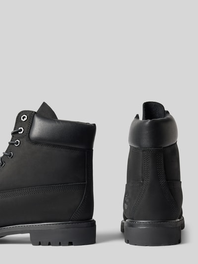 Produktfoto, Boots aus echtem Leder mit Logo-Detail von Timberland in Schwarz, abgerundete Passform, profilierte Sohle, Schnürverschluss, Damen Boots, Info: Absatzhöhe 4 cm, Schafthöhe 15 cm, Schaftweite 10 cm