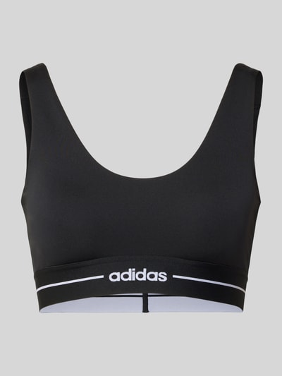 Produktfoto, BH met elastische logo-band van adidas Sportswear, zwart, stretch-materiaal, aansluitende pasvorm, gladde textuur.