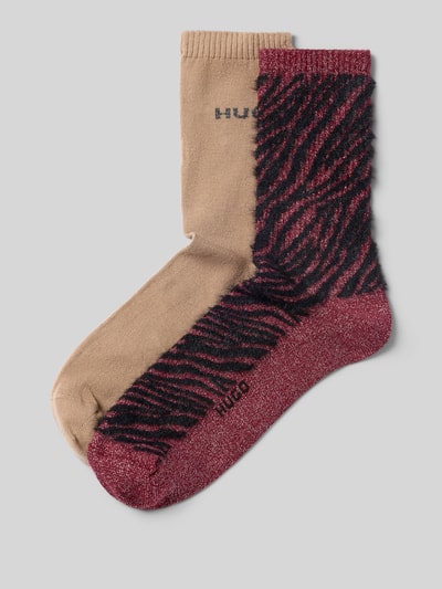 Produktfoto, Socken mit Logo-Schriftzug im 2er-Pack von HUGO aus Baumwollmix, abstraktes Allover-Muster, beige und bordeaux mit Schwarz.