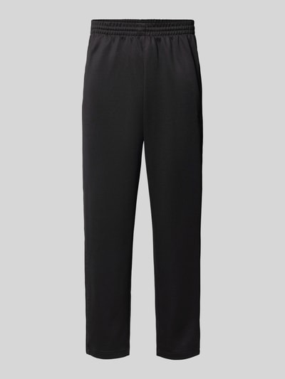 Produktfoto, schwarze Straight Fit Sweatpants mit elastischem Bund von adidas Originals, Baumwoll-Mix, Eingrifftaschen, glatte Struktur.