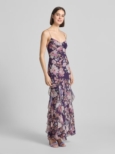 Frauenmodel trägt Slim Fit Abendkleid mit Rüschenbesatz von ADLYSH, floraler Allover-Print, Spaghettiträger, Schnürverschluss, Ganzkörperansicht von vorne.