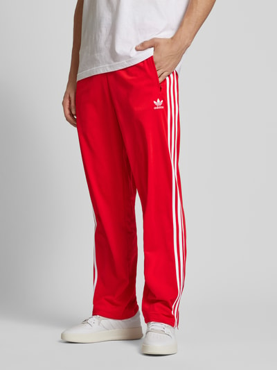 adidas Originals Spodnie dresowe o kroju regular fit z wyhaftowanym logo model ‘FIREBIRD’ Czerwony 4