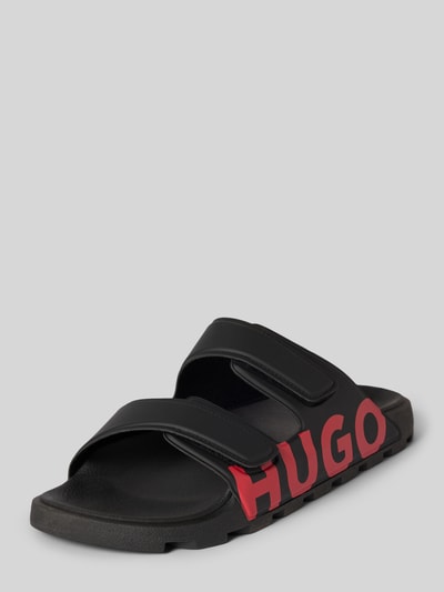 Produktfoto, Sandale mit Logo Print von HUGO für Herren in Two-Tone-Optik, abgerundete Schuhspitze, flache Absatzform, zwei Riemen mit Klettverschluss, Logo-Print