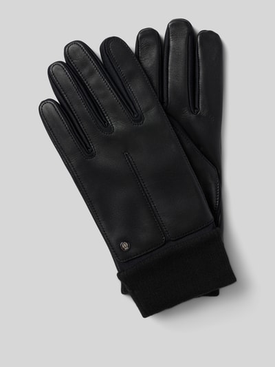 Produktfoto, schwarze Lederhandschuhe aus echtem Leder Modell 'Kopenhagen' von Roeckl mit Ziernähten, metallic Label-Detail und elastischen Rippbündchen, glatte Textur, rechteckige Form.