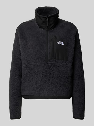 Produktfoto, Fleecepullover mit Troyer-Kragen Modell 'YUMIORI' von The North Face, schwarz, gerade Passform, Label-Detail, elastische Abschlüsse