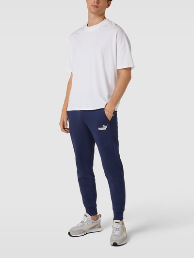 PUMA PERFORMANCE Sweatpants met labelprint Donkerblauw - 1