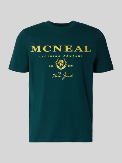 Produktfoto, T-Shirt mit Label-Print und Rundhalsausschnitt von MCNEAL, Herren T-Shirt aus Reine Baumwolle, Regular-Fit, Rückenlänge 68 cm, dunkelgrün mit gelbem Print, glatte Textur