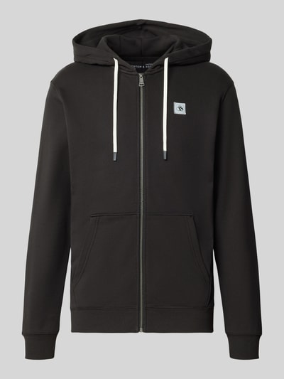 Produktfoto, Sweatjacke mit Logo-Patch und Känguru-Tasche von Scotch & Soda in Schwarz, gerader Schnitt, Kapuze, Reißverschluss, reine Baumwolle, gerippte Abschlüsse, Kordelzug, Vorderansicht
