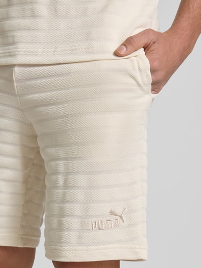 PUMA PERFORMANCE Slim Fit Shorts mit Strukturmuster Modell 'ESS ELEVATED' Offwhite 3