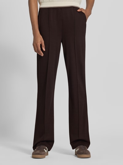 Frauenmodel trägt Straight Fit Hose aus Viskose-Mix von Milano Italy, dunkle Farbe, Ziernaht, elastischer Bund, Nahaufnahme Unterkörper. Damen Hose von Milano Italy, Elastischer Viskose-Mix, Gerade Form, Bundweite 36 cm, Innenbeinlänge 89 cm.