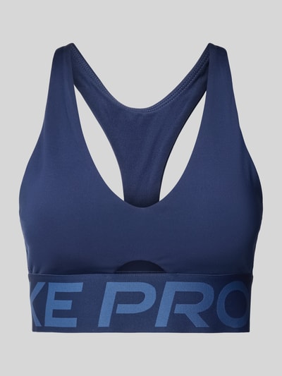 Produktfoto, dunkelblaues Bustier mit Label-Details und Cut-Out von NIKE TRAINING, Racerback, körpernahe Passform, glatte Textur.