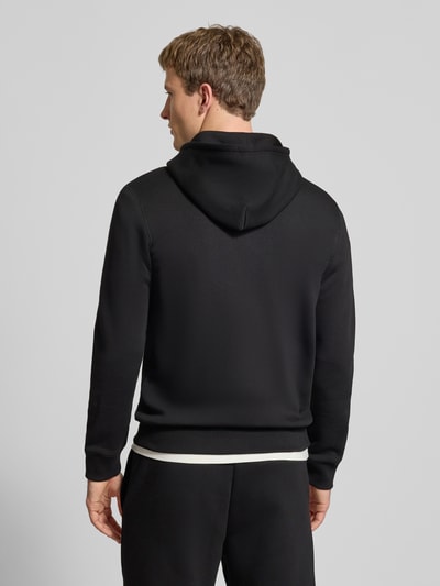 Männermodel trägt Sweatjacke mit Kapuze von REVIEW aus schwarzer Baumwollmischung, Slim-Fit mit elastischen Abschlüssen, Rückenansicht.