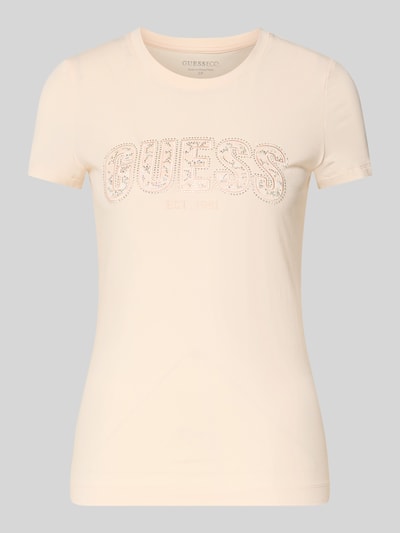 Produktfoto, Slim Fit T-Shirt mit Strasssteinbesatz von Guess aus elastischem Baumwoll-Mix in Beige mit Rundhalsausschnitt und Logo-Detail.