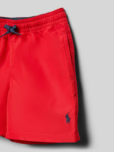 Produktfoto, Badehose mit Tunnelzug von Polo Ralph Lauren Kids in Unifarben mit Logo-Stitching, Mesh-Einsatz, elastischem Bund, seitlichen Eingrifftaschen und Gesäßtasche mit Knopf.