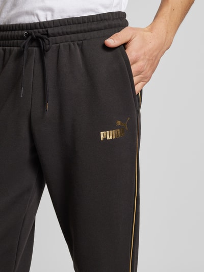 PUMA PERFORMANCE Spodnie dresowe o kroju relaxed fit z nadrukiem z logo Czarny 3