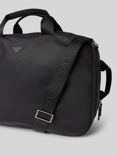 Produktfoto, Rucksack mit Label-Detail von Emporio Armani in Schwarz mit Rundum-Reißverschluss, Tragehenkel und verstellbaren Schulterriemen, glatte Oberfläche, silberne Details, Innenfach mit Reißverschluss, Maße 52x36x16 cm, Schulterriemen 72 cm.