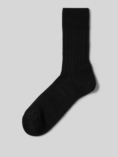 Produktfoto, schwarze Strümpfe aus Schurwollmischung Modell 'Teppich im Schuh' von FALKE mit Rippenstruktur und gepolsterter Sohle