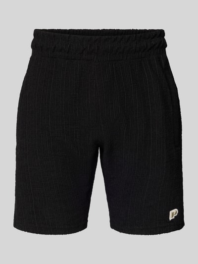 Produktfoto, Shorts mit Label-Patch Modell 'LIBCO' von Pegador, schwarz, Strukturmuster, elastischer Bund, gerader Schnitt, Baumwoll-Mix