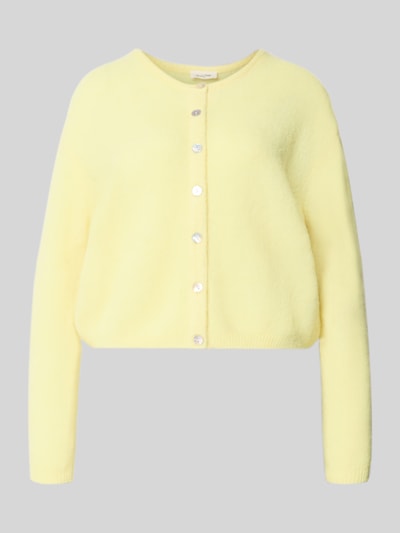Produktfoto, Relaxed Fit Strickjacke aus Woll-Mix mit Leinen-Anteil von American Vintage in Pastellgelb, gerippte Bündchen, Knopfleiste, langärmlig, Rückenlänge 52 cm, Ärmellänge 56 cm
