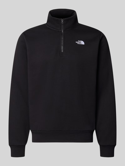 Produktfoto, schwarzes Regular Fit Sweatshirt mit Troyer Modell "EVOLUTION" von The North Face, Baumwoll-Mix, Logo-Stitching, elastische Abschlüsse
