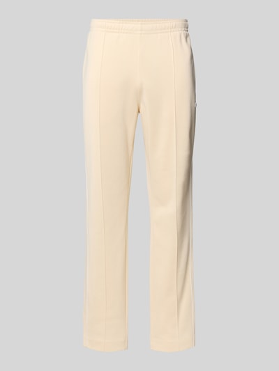 Produktfoto, Regular Fit Sweatpants mit Baumwoll-Anteil von Lacoste in Creme, unifarben, Galonstreifen, elastischer Bund, Sweat-Material-Mix