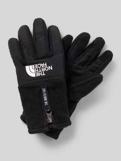 Produktfoto, schwarze Handschuhe mit Reißverschluss Modell 'DENALI ETIP' von The North Face, weiche Struktur, Label-Details, glatte und strukturierte Flächen, Herren Handschuhe, Fingerhandschuhe