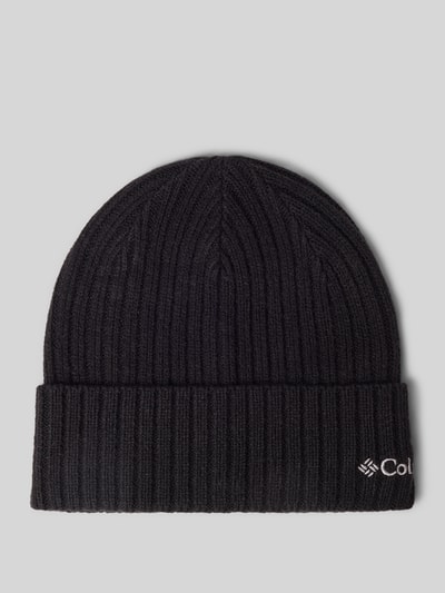 Produktfoto, schwarze Mütze in Strick-Optik Modell 'COLUMBIA' von Columbia mit fixiertem Saum und Logo-Detail auf grauem Hintergrund.