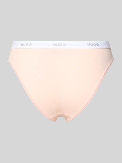Frauenmodel trägt Slip aus Baumwoll-Mix Modell 'HUGO ID BRIEF' von HUGO in Optik: Unifarben mit Label-Bündchen, Ganzkörperansicht Rückansicht.