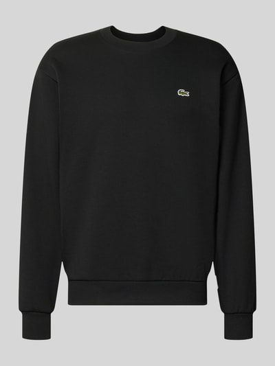Produktfoto, Regular Fit Sweatshirt aus Baumwoll-Mix von Lacoste in Schwarz mit rundem Halsausschnitt, Rippenbündchen und glatter Struktur.