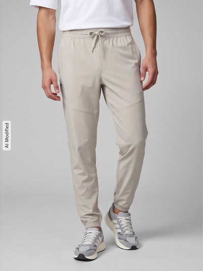 Under Armour Relaxed Fit Trainingshose mit Label-Print Khaki 4