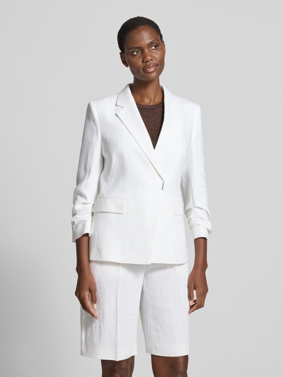 Vrouwenmodel draagt Slim Fit Kurzblazer uit linnen-viscose-mix model 'JIA8' van BOSS, mêlee look, reverskraag, twill, lange mouw, 1-knoopssluiting, klepzakken, mix van linnen en viscose, model van voren gefotografeerd, busteopname.