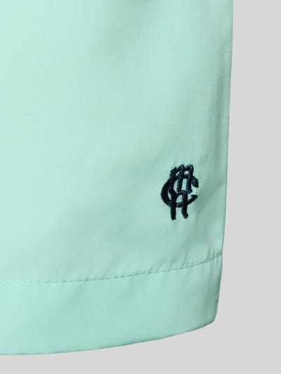 Produktfoto, Badehose mit Gesäßtasche und Logo-Stitching von MCNEAL in Mintgrün, glatte Stoffstruktur, sichtbares Logo-Stitching