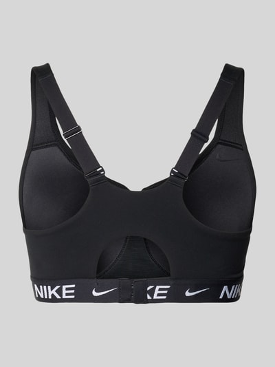 Produktfoto, Bustier mit Label-Details und verstellbaren Trägern von NIKE TRAINING aus Material-Mix mit Stretch-Anteil, Hakenverschluss, körpernahe Passform, schwarze Farbe, glatte Textur.