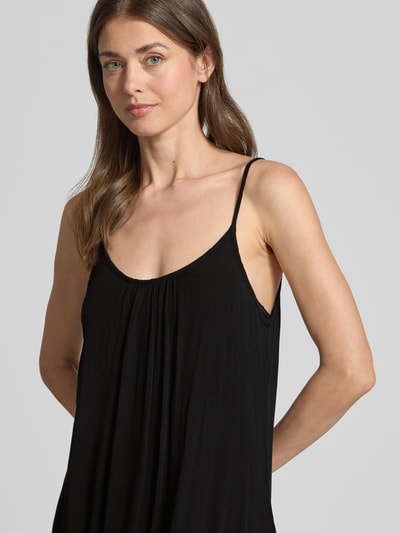 Frauenmodel trägt Minikleid aus Viskose mit tiefem Rückenausschnitt von Shiwi, A-Linie, Modell Ibiza Dress Solid, Nahaufnahme Oberkörper.