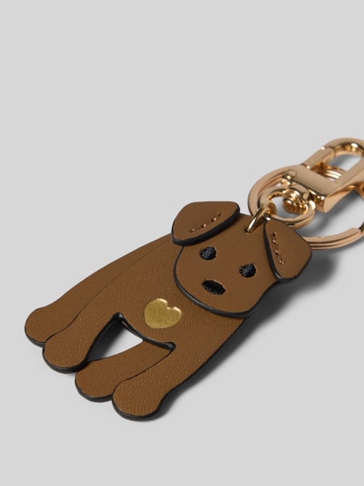 Produktfoto, Motiv-Schlüsselanhänger mit Karabiner von Seidenfelt, brauner Anhänger in Hundeform mit goldfarbenem Herz, Damen Schlüsselanhänger, strukturierte Oberfläche