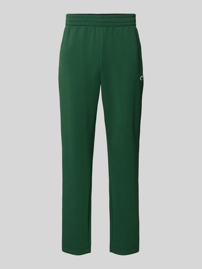 Produktfoto, Tapered Sweatpants mit bawełnianym udziałem od Lacoste, efekt: jednolity kolor, naszywka z logo, krój tapered, tunel, elastyczny ściągacz, boczna kieszeń zapinana na zamek błyskawiczny, wykończenie materiału: scuba