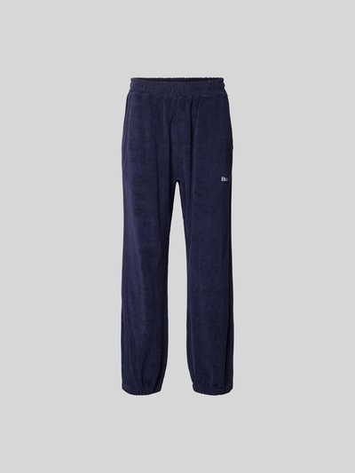 Produktfoto, Sweatpants aus reiner Baumwolle von RHUDE in Dunkelblau mit lockerer Passform, elastischem Bund, Frottee, elastischen Beinabschlüssen.