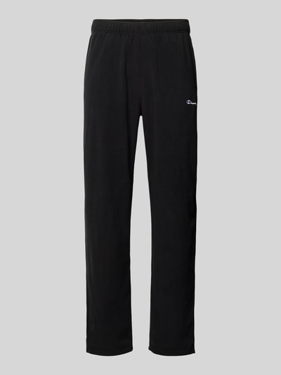 Produktfoto, schwarze Sweatpants mit elastischem Bund und Label-Stitching von CHAMPION, lockerer Schnitt, Innenbeinlänge 75 cm bei Größe M