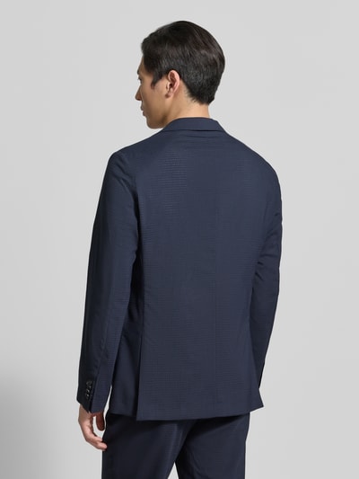 Männermodel trägt Slim Fit Anzugsakko aus Woll-Mix Modell 'P-HANRY-WG-PK' van BOSS, look: effen, wolmix, ganzlichamenaanzicht achterkant.