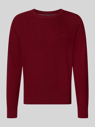 Produktfoto, Regular Fit Pullover aus Baumwoll-Woll-Mix von GANT in dunklem Rot mit feinem Strickmuster auf grauem Hintergrund.