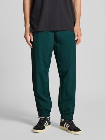 adidas Originals Spodnie dresowe z elastycznym ściągaczem Ciemnozielony 4