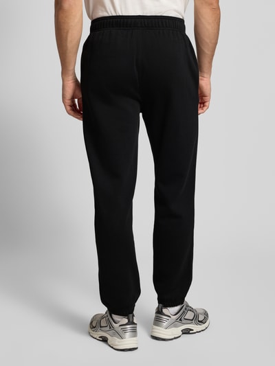 CHAMPION Spodnie dresowe z elastycznym ściągaczem Czarny 5